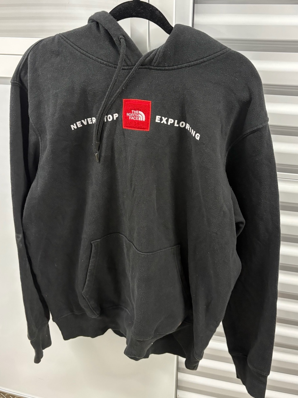 The North Face Men's Black Hoodie with Red Logo Patch
